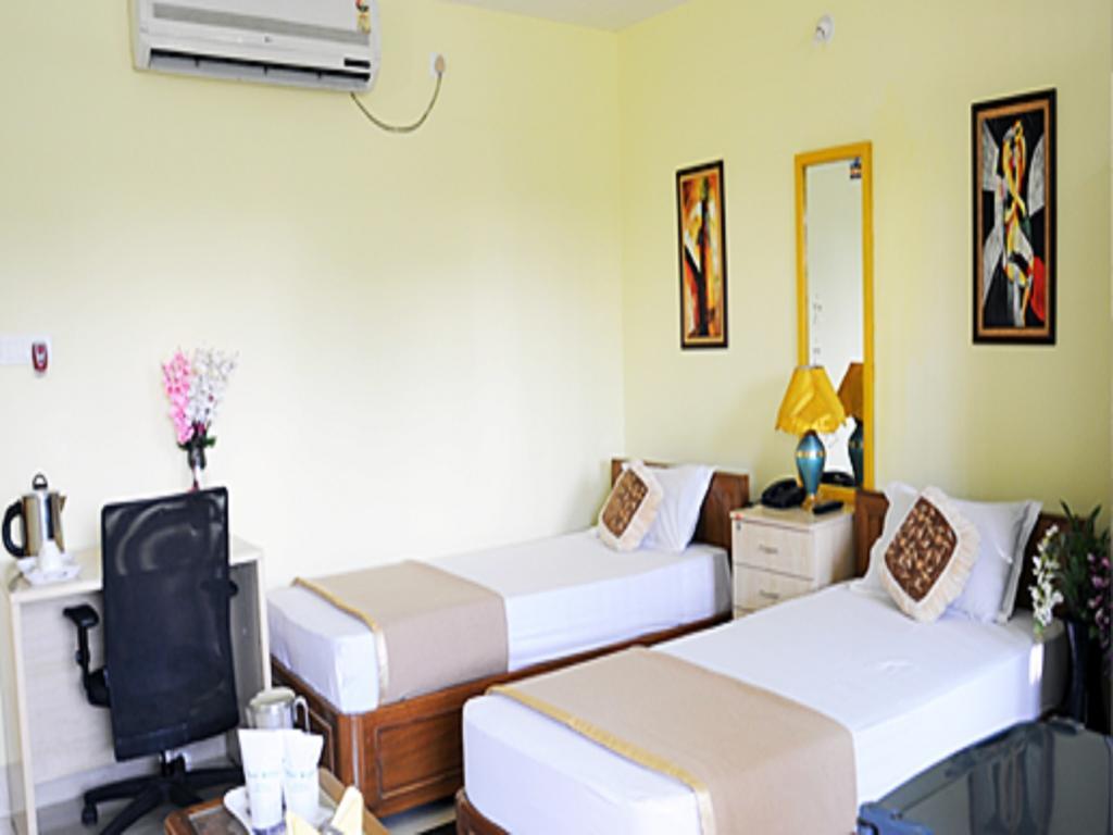 Hotel Pine Yard Tezpur Quarto foto